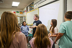 teacher teaching to her class
